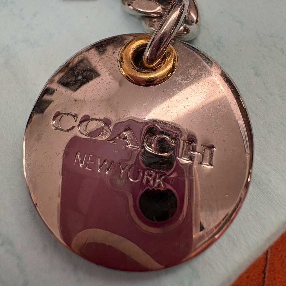 Nwot UNIQUE Coach Silver and Gold Keychain
has been put away for years